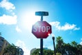 Collins ave stop sign with trees in the background and some sky Royalty Free Stock Photo