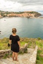 Young woman in The Royal Castle of the tourist city of Colliure in Occitania, France. Royalty Free Stock Photo