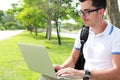Colllege student working on assignments using laptop Royalty Free Stock Photo