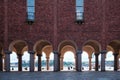 The collonnade arch passage and brick facade at the Town City hall of Stockholm