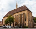 Colmar in Alsace, France. Collegiate Church of San Martino, one of the symbols of the city on the canals. Royalty Free Stock Photo