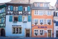 Colmar, France - April 30, 2017: Blue and orange half timber restaurant houses in Colmar, Alsace region, East France