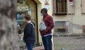 Colmar, France, August 31, 2020: African man wearing protective covid-19 face mask. Touristy spots in the covid era