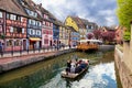 Colmar, France. Boat with tourists on canal