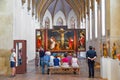 people admire the Isenheim Altarpiece from sculpture Nikolaus Hagenauer and painter Matthias Gruenewald from 1512 to 1516 Royalty Free Stock Photo