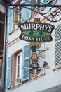 Closeup of Murphy`s pub logo on retro signboard in the street Royalty Free Stock Photo