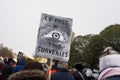 People protesting against the sanitary pass with banner in french : Le pass tous surveilles, in english : the pass all watched