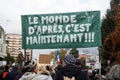 People protesting against the sanitary pass with text in french : Le monde d`aprÃÂ¨s, c`est maintenant, in english : the next worl