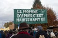 people protesting against the sanitary pass with text in french : Le monde d`aprÃÂ¨s, c`est maintenant, in english : the next w