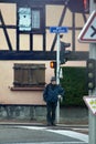 Crossing street at traffic light. Traffic regulations