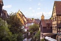 Little Venice in Colmar. Famous landmark, romantic village with half-timbered houses by the bank of canal, tower of church in the Royalty Free Stock Photo