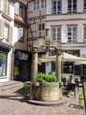 Colmar, 8th august: Old Stone Fountain from Cathedral Square in Old Town of Colmar in Alsace region , France
