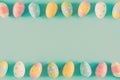Coloeful easter eggs on pastel color background with space. Royalty Free Stock Photo