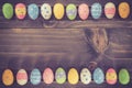Coloeful easter eggs on plank wooden background with space. Royalty Free Stock Photo