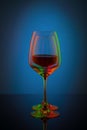 Coloful wineglass on table. Royalty Free Stock Photo