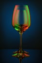 Coloful wineglass on table. Royalty Free Stock Photo