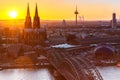 Cologne Cathedral church Hohenzollern bridge Germany skyline city town sunset Royalty Free Stock Photo