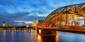 Cologne Cathedral city skyline and Hohenzollern bridge with Rhine river in Germany at twilight panoramic view Royalty Free Stock Photo