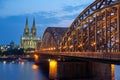 Cologne Cathedral and Hohenzollern Bridge at sunset Royalty Free Stock Photo