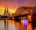 Cologne Cathedral and Hohenzollern Bridge at sunset, Germany Royalty Free Stock Photo