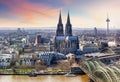 Cologne Cathedral and Hohenzollern Bridge at sunset - night Royalty Free Stock Photo