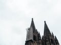 Cologne Cathedral with scaffold against cloudy sky Royalty Free Stock Photo
