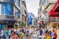 Crowd of people tourists walking down pedestrian shopping street Hohestrasse in Cologne Royalty Free Stock Photo