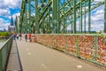 COLOGNE, GERMANY, AUGUST 11, 2018: People are passing on Hohenzollern bridge over Rhein during sunset, Germany Royalty Free Stock Photo