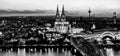 Black and white night landscape of the gothic Cologne cathedral, Hohenzollern Bridge and the River Rhine in Cologne, Germany Royalty Free Stock Photo