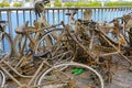 Pile many old muddy rusty bicycles thrown into the rhine and then salvaged