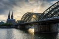 COLOGNE, GERMANY, 23 JULY 2020 Sunburst sunset right on the Hohenzollern Bridge, Cologne Cathedral on the background Royalty Free Stock Photo