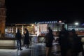 Selective blur on young people standing by people rushing in front of Koln Hbf