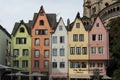 COLOGNE, GERMANY - SEPTEMBER 11, 2016: Colorful houses in Bavarian style and the Romanesque Catholic church `Gross Sankt Martin`