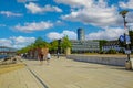 Beautiful rhine riverside promenade, hyatt regency hotel building, blue summer sky, fluffy white cumulus summer clouds