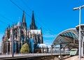 Cologne Koln, Germany: Cologne Central Railway Station Historical Architecture near the Dom Cathedral, against Blue Sky, with Trai