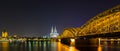 Cologne night skyline with cathedral and hohenzollern bridge