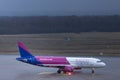 Wizz airlines airplane at cologne bonn airport germany in the rain