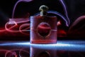 Bottle of cologne perfume on red light background