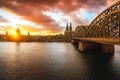 Cologne Skyline with Cathedral, Hohenzollern Bridge and Great St. Martin Church at sunset - Cologne, Germany Royalty Free Stock Photo