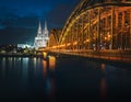 Cologne Skyline with Cathedral and Hohenzollern Bridge at night - Cologne, Germany Royalty Free Stock Photo