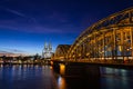 Cologne skyline with Cologne Cathedral and Hohenzollern bridge at night Royalty Free Stock Photo