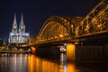 Cologne skyline with Cologne Cathedral and Hohenzollern bridge at night Royalty Free Stock Photo