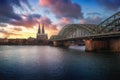 Cologne Skyline with Cathedral and Hohenzollern Bridge at sunset - Cologne, Germany Royalty Free Stock Photo