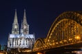 Cologne skyline with Cologne Cathedral and Hohenzollern bridge at night Royalty Free Stock Photo