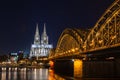 Cologne skyline with Cologne Cathedral and Hohenzollern bridge at night Royalty Free Stock Photo