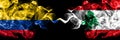 Colombia, Colombian vs Lebanon, Lebanese smoky mystic flags placed side by side. Thick colored silky abstract smokes flags