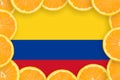 Colombia flag in fresh citrus fruit slices frame