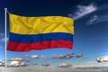 Colombia national flag waving in the wind against deep blue sky.  International relations concept Royalty Free Stock Photo