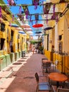 Colombia, Santa Marta, hanging colorful umbrellas and overhead decorations in the historic center