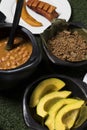 Colombian black clay pot with red bean soup, medellin dish